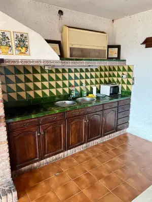 a bathroom with two sinks and a tiled counter at Villa Agaporni in Senmanat