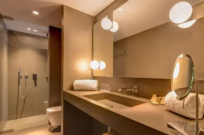 a bathroom with a sink and a shower and a mirror at Ohla Eixample in Barcelona