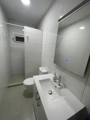 a white bathroom with a sink and a toilet at Private room next to BCN airport in El Prat de Llobregat