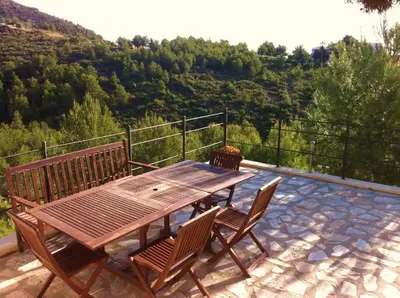 a table and two chairs sitting on a balcony at Independ room in villa with views 2 in Castelldefels