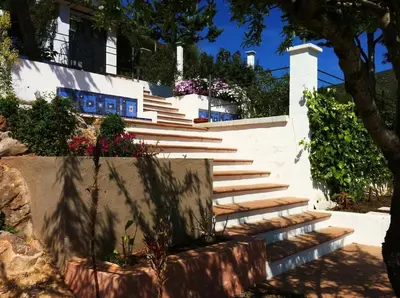 a balcony of a house with a view of the ocean at Independ room in villa with views 2 in Castelldefels