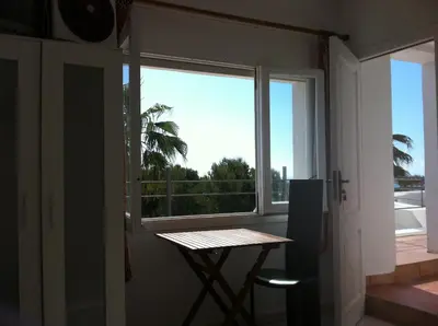 a window in a room with a table and a table sidx sidx sidx at Independent Room in private villa with view1 in Castelldefels