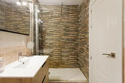 a bathroom with a sink and a shower at Fantastic Penthouse in Barcelona