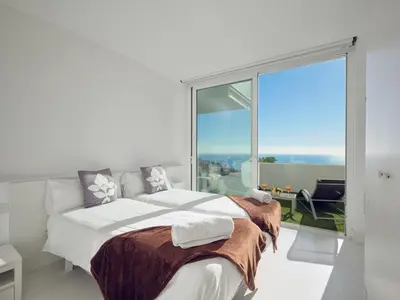 a bedroom with a bed and a large window at Villa in Sitges with Pool, Jacuzzi, BBQ, View, AC, 12Pax in Sitges