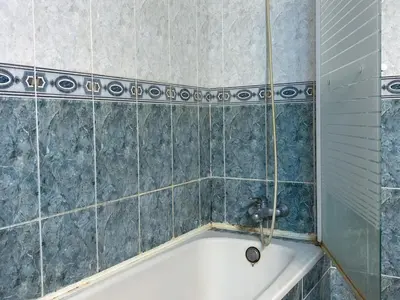a bathroom with a bath tub with a sink at Apartment Iolanda in Vilanova i la Geltrú