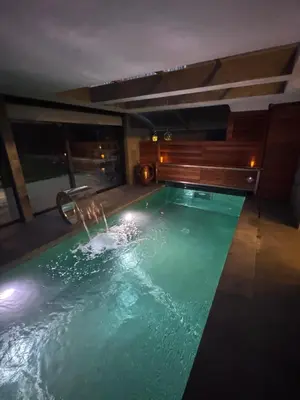 a pool of water in a room with at SuitePoolBarcelona in Vilassar de Dalt