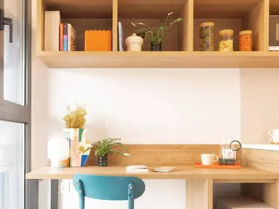 a kitchen with white cabinets and a sink at Canvas Sabadell Llac in Sabadell