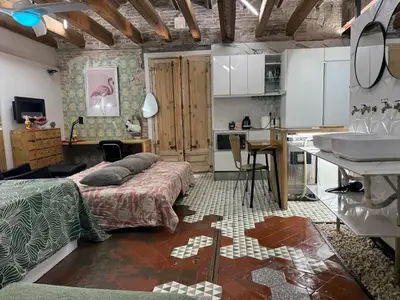 a bedroom with a bed and a kitchen with a sink at VERSACE 4PACK -SMART HOME- AIR CONDITIONER - GOTIC quarter- PRIVATE STUDIO- Beach 10 minutes in Barcelona