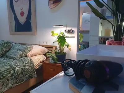 a room with a couch and a table with a coil of yarn at VERSACE 4PACK -SMART HOME- AIR CONDITIONER - GOTIC quarter- PRIVATE STUDIO- Beach 10 minutes in Barcelona