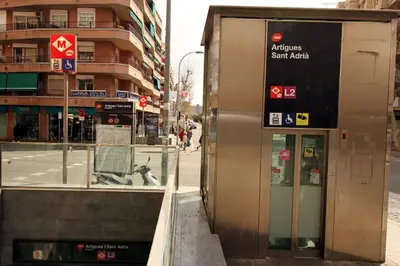 a building with a sign on the side of a street at 3 min to metro Center 15 min by metro Beach 15min in Santa Coloma de Gramanet
