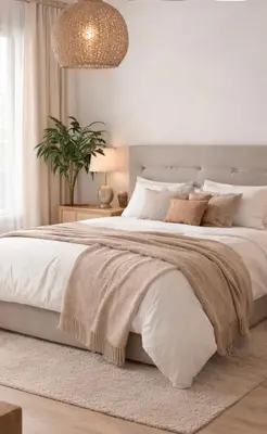 a bedroom with a large bed with white sheets and pillows at stressless house in Barcelona