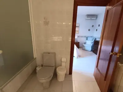 a bathroom with a toilet and a walk in shower at El Mirador de Can Barri BB Vistas Piscina y Desayuno Gourmet in Bigues i Riells