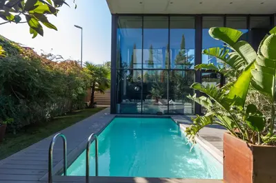 a swimming pool in the backyard of a house at Espai Oliveres Barcelona Villa con piscina in Papiol
