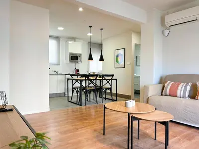 a living room with a couch and a table at Apartment Goya in Vilanova i la Geltrú