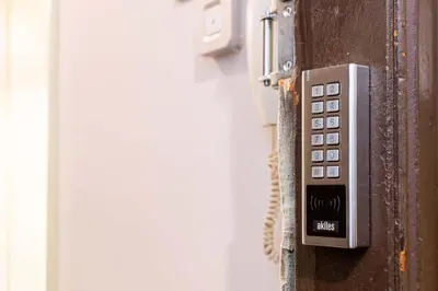a phone attached to the side of a wall at BOLIVIA. NEWLY RENOVATED FULL APARTMENT WITH BRIGHT TERRACE in Barcelona