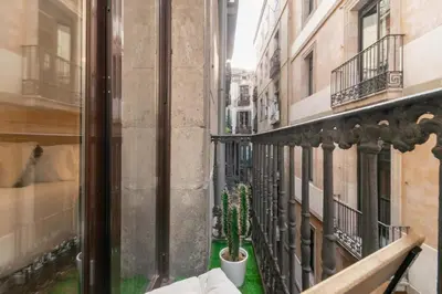 a view from a balcony of a building with a cactus at BOLIVIA. NEWLY RENOVATED FULL APARTMENT WITH BRIGHT TERRACE in Barcelona