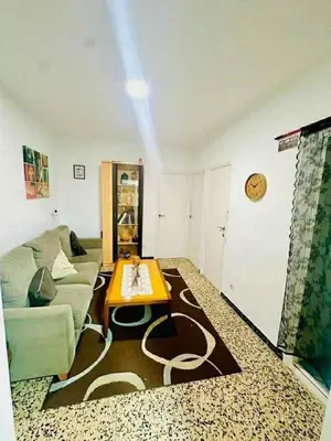 a living room with a couch and a coffee table at Barcelona stay in Hospitalet de Llobregat
