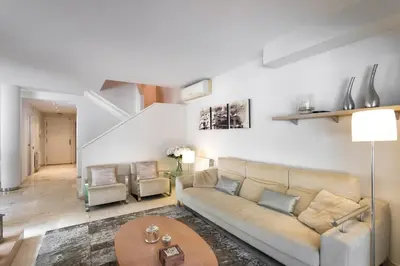 a living room with a couch and a table at TARRACO - Private Pool Villa in Arenys de Munt in Arenys de Munt