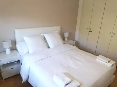 a white bed with two towels on top of it at TARRACO - Private Pool Villa in Arenys de Munt in Arenys de Munt