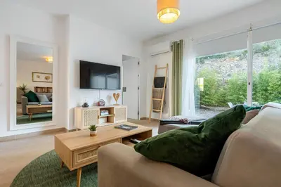 a living room with a couch and a table at Hauzify I Casa Olivella A in Olivella