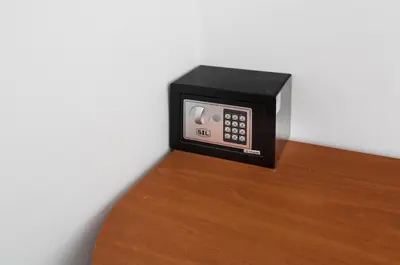 a black microwave sitting on top of a wooden table at Apartamento 2º centrico con Parking en Calella,Barcelona in Calella