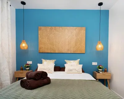 a bedroom with a large white bed and windows at Studio for 3 - 2B in Sant Adria de Besos