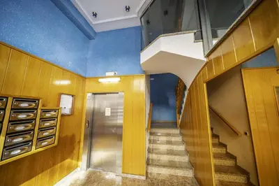 a hallway with stairs and a blue ceiling at HomeHolidaysRentals Coquette - Costa Barcelona in Pineda de Mar