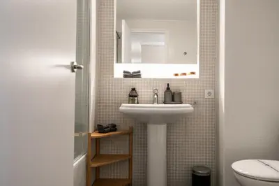 a bathroom with a sink and a toilet at Eixample Barcelona Luxury for 8 in Barcelona