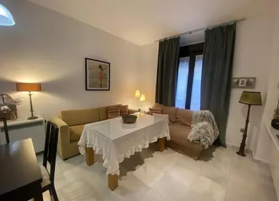 a living room with a couch and a table at Cristina in Arenys de Mar