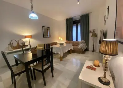 a living room with a table and a couch at Cristina in Arenys de Mar