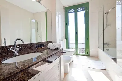 a bathroom with a sink and a toilet and a shower at Bcncaliu in Barcelona