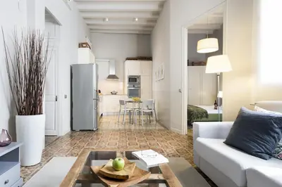 a living room with a couch and a table at Ola Living Gaudi in Barcelona