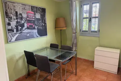 a dining room with a glass table and two chairs at NEW! Apartment for 4 people near the beach in Poblenou in Barcelona