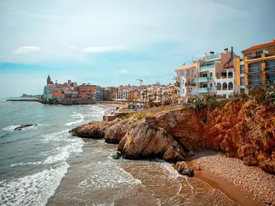 a view of a beach with buildings and the ocean at Designer villa with sauna and swimming pool in Canyelles
