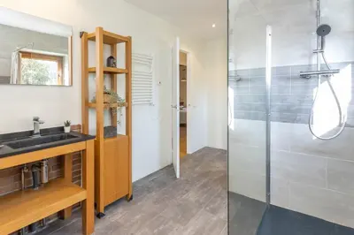 a bathroom with a sink and a shower at Casa con encanto a los pies del Montseny in La Batlloria