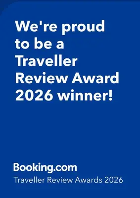 a blue sign that says were proud to be a traveller review award winner at Casa De Poble Termes Romanes in Caldes de Montbui