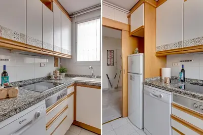a kitchen with white cabinets and a sink at 4 Bedroom High-Rise Apartment Amazing views! in Barcelona