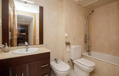 a bathroom with a toilet and a sink and a shower at Beautiful Apartment In Pineda De Mar in Pineda de Mar