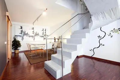 a staircase in a room with a table and a dining room at My Space Barcelona Private Pool Garden in Barcelona