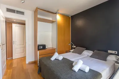 a bedroom with two beds with white pillows on them at My Space Barcelona Penthouse Terrace in Barcelona