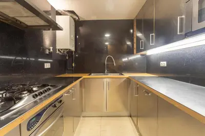 a kitchen with a sink and a stove at My Space Barcelona Penthouse Terrace in Barcelona