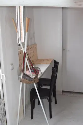 a room with a table and a chair with bats at Apartments San Ignacio de Loyola in Manresa