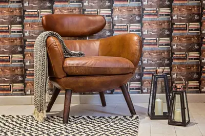 a brown leather chair sitting in a room at Sweett - Sants in Barcelona