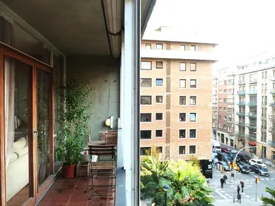 an apartment balcony with a view of a city at Joanic Apartment Escorial in Barcelona