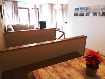 a living room with a couch and a table at Joanic Apartment Escorial in Barcelona