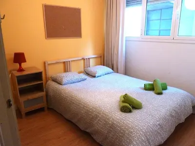 a bedroom with two beds with stuffed animals on them at Joanic Apartment Escorial in Barcelona