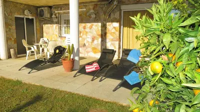 a group of chairs sitting on a patio at Villa Carolina in Mataró