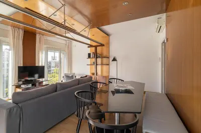a living room with a couch and a table at Stay U-nique Apartments Salvador Espriu in Barcelona