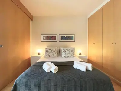 a bedroom with a bed with two towels on it at Stay U-nique Apartments Venecuela in Barcelona