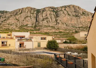 a view of a mountain from a house at Hotel Can Missé in Collbató